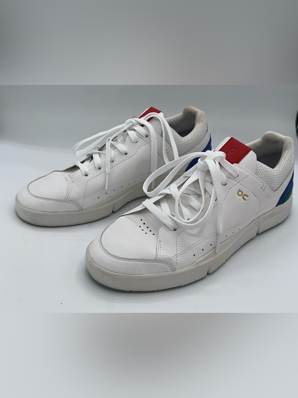 On Running White Low-Top Sneakers with Blue & Red Accents